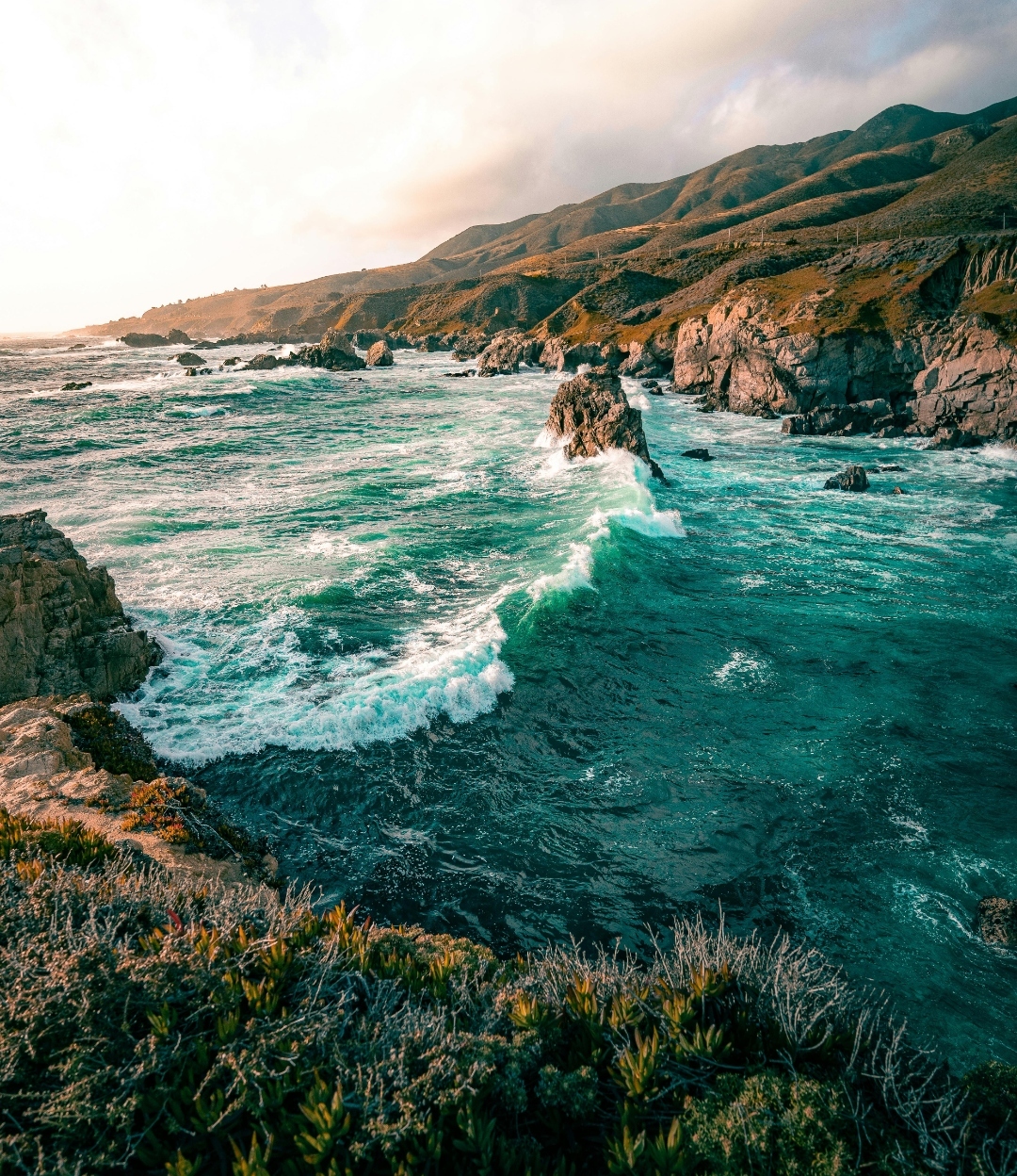 Turquoise Pacific surf below the cliffs at Garrapata State Park